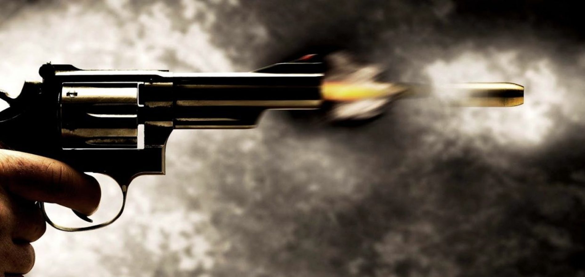 Imagem de um revolver atirando
